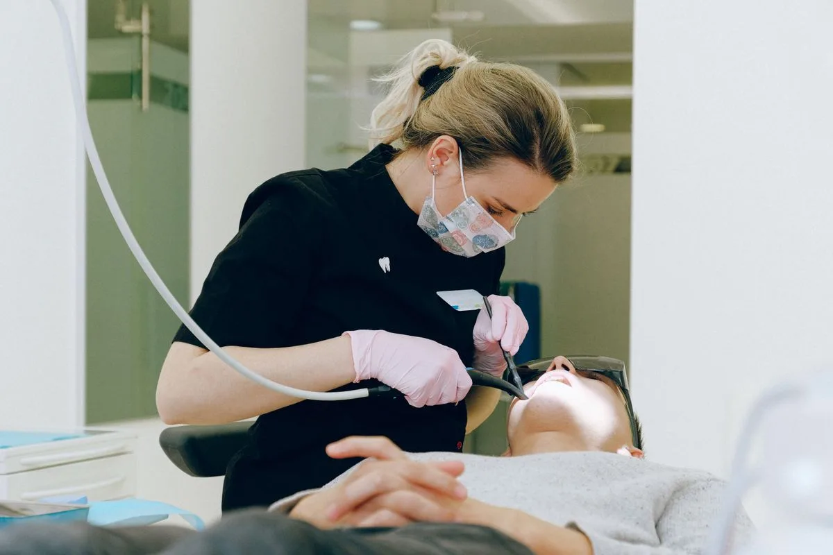 Dentist caring for a patient during a dental consultation