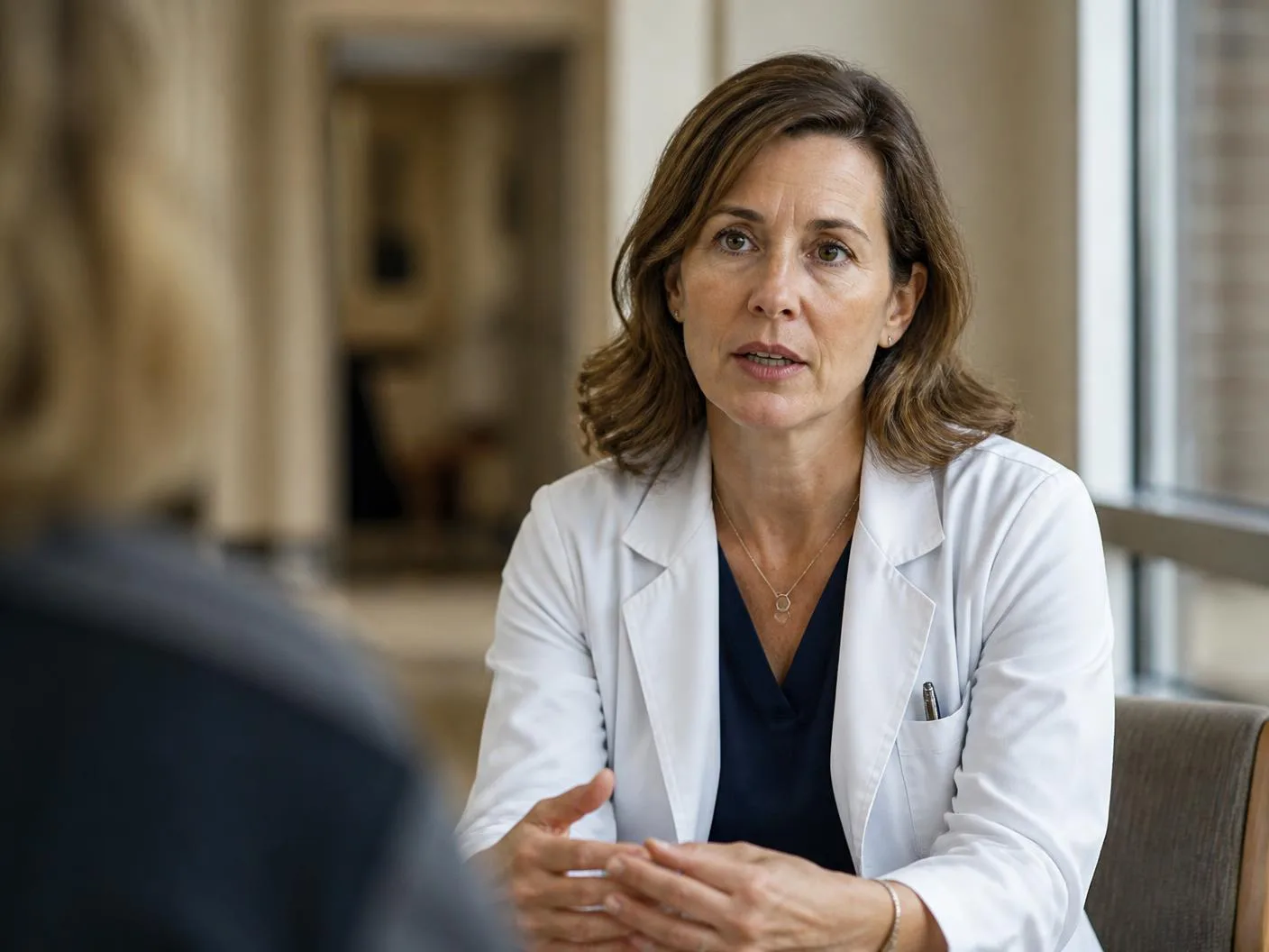 Healthcare professional discussing care in a clinical environment